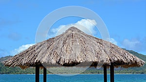 Water bungalow straw roof tropical island background