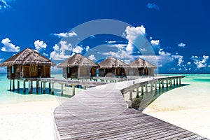 Water bungalows with beautiful blue sky and sea in Maldives