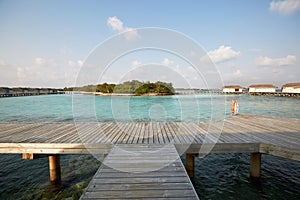 Water bungalows in hotel on Maldives. Villas on Indian ocean at luxury spa resort.