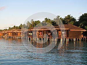 Water bungalows at sunset