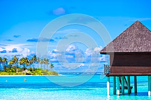 Water bungalows and wooden jetty on Maldives