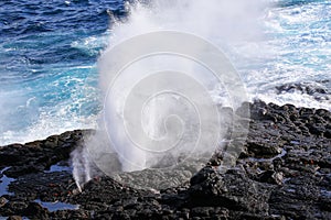 Water bursts through blowhole on Espanola Island, Galapagos National park, Ecuador