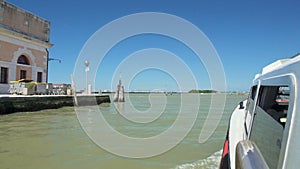 Water bus exiting Grand Canal, heading for Venetian Lagoon islands, tourist trip