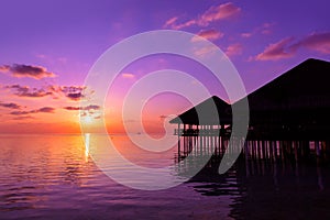 Water cafe at sunset - Maldives