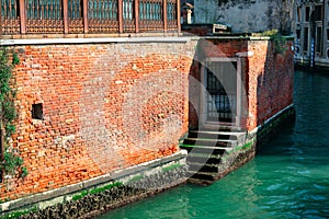 Water canal and brick wall