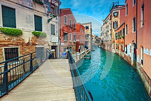 Water canal with bridges and old buildings in Venice, Italy