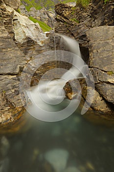 Water cascade in a small rocky gorge