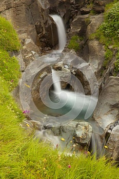 Water cascade in a small rocky gorge