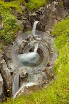 Water cascade in a small rocky gorge