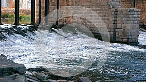 Water cascade streaming down a lasher. Waterfall.