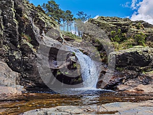 Water cascades down the rocks below