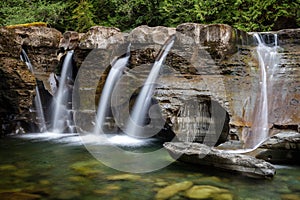 Water cascades over rocks with small falls within Comox Valley.