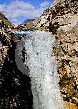 Water cascading over rocks in a creek near Arsiero, Italy