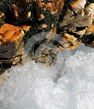 Water cascading over rocks in a creek near Arsiero, Italy