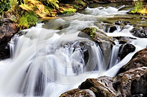 Water cascading over rocks in a mountain stream.