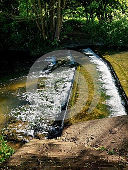 Water cascading over weir