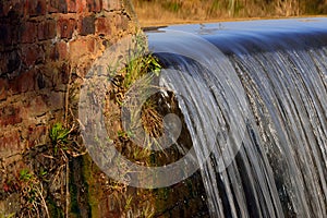 Water Cascading Over Weir