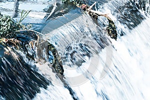 Water flowing over a river weir