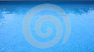 Water Caustic Background. water waves and lines of blue tile swimming pool.