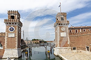 Water channel and entrance gate to Venetian Arsenal in Italy