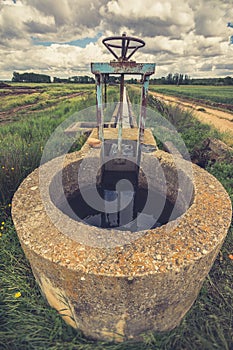 Water channel in a irrigated crop plantation in the province of Zamora Spain