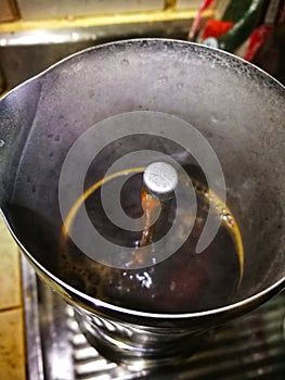 Water of a coffee boiling in a coffee pot