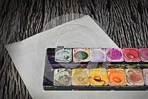 Water color paint box on dirty paper