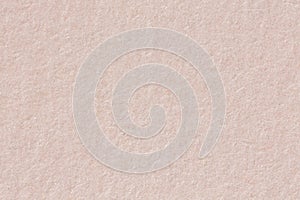 Water color paper texture background in light beige tone with vignette.