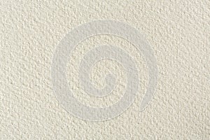 Water-colour paper texture background in light beige tone.