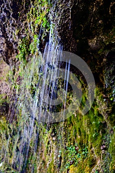 Water coming out of the stone wall