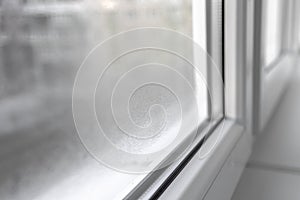 Water condensation on PVC windows during autumn. Plastic window.