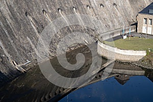 Water and a cottage at the bottom of a dam at the Edersee