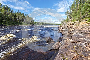 The water course of Ounasjoki Ã¢â¬â Molkojoki river bordered by pin forests in Finnish Lapland photo