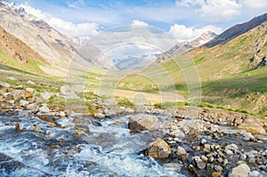 Water creek stream rocks meadow mountain peak landscape