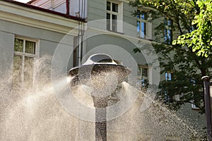 The water curtain as a monument in the city during dangerous heat. Heat. Summer
