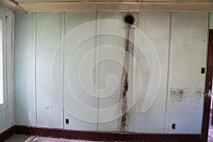 Water damage on a wall in an abandoned building in the Bannack Ghost Town, Montana photo