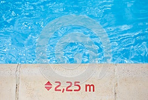 Water depth mark on pool edge