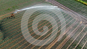Water distributed on an agricultural field and atomized by the wind seen by an aerial view