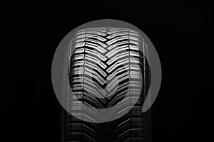 water-diverting tire with directional tread, wet braking and aquaplaning photo