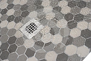 Water draining in shower floor.