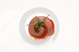 Water dripping on tomato