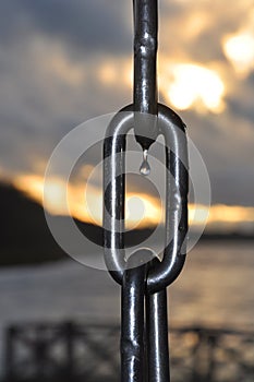 Water drop on an anchor chain.