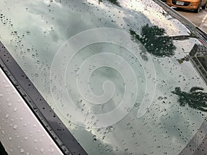 Water drop and back glass windshield of car