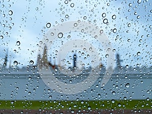 Water drop on car glass when raining in monsoon season