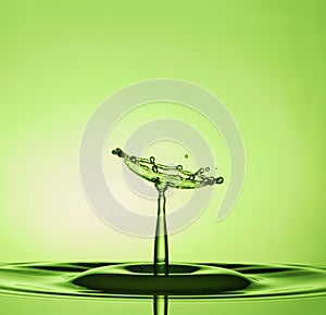 Water Drop Collisions Macro Photography with green  background