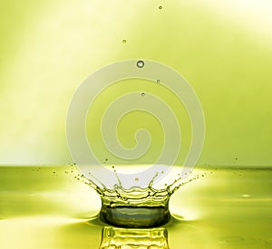 Water Drop Collisions Macro Photography with green background