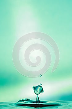 Water Drop Collisions Macro Photography with green background