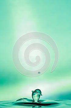 Water Drop Collisions Macro Photography with green background