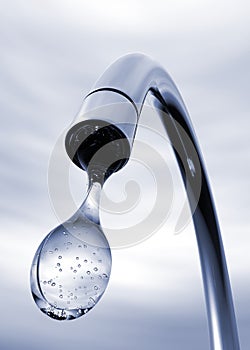 Water drop coming out of tap