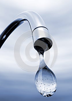 Water drop coming out of tap